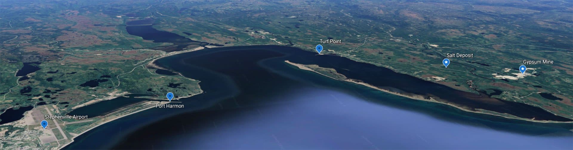 Aerial view of Bay St. George showing Turf Point, the salt deposit, Port Harmon and Stephenville Airport